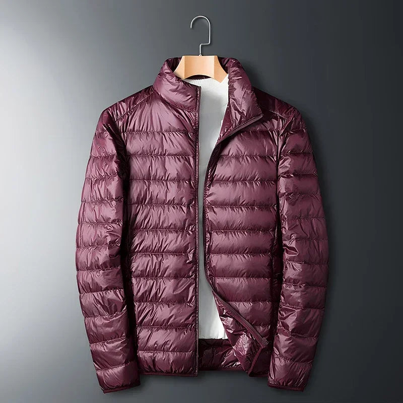The ArcticWave men's lightweight down jacket shown in a stylish burgundy color.