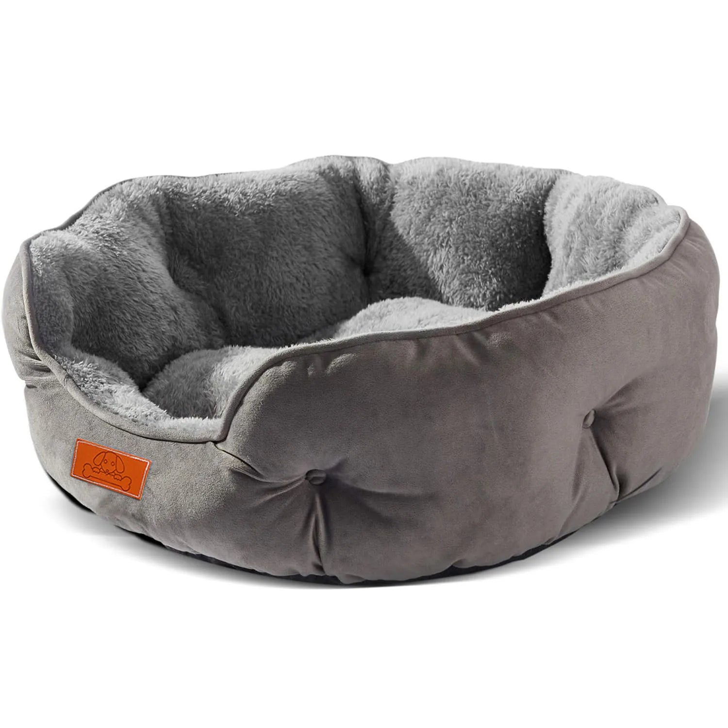 A clean product shot of the round grey pet bed showing its plush corduroy material and soft interior.