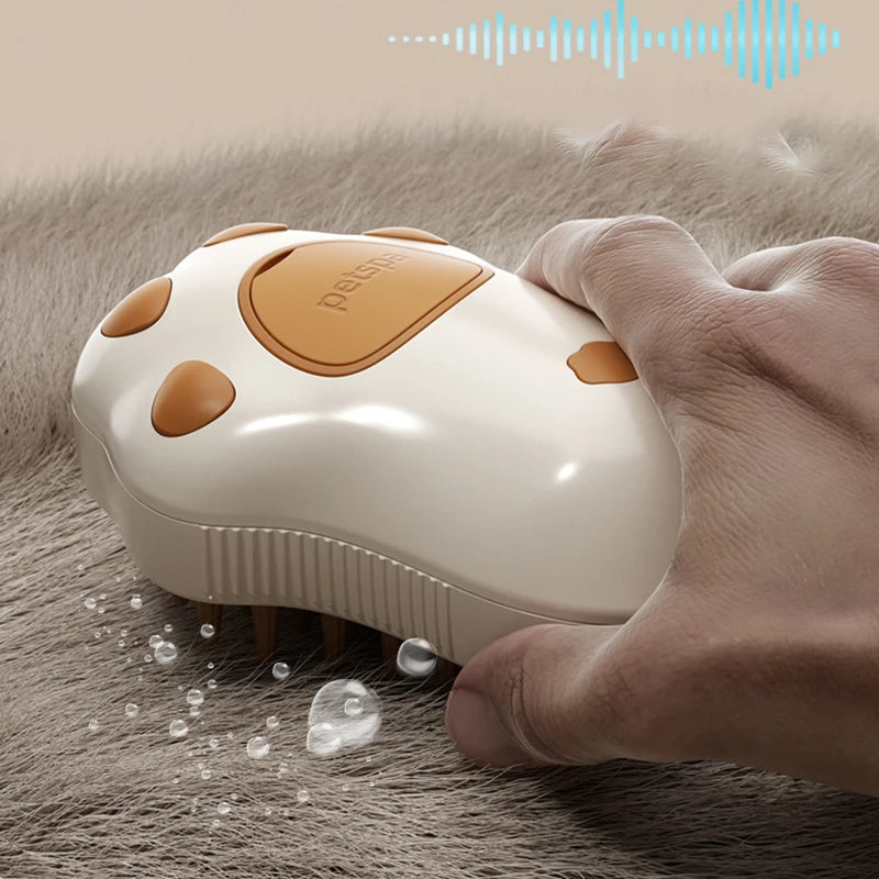 A hand grooming a cat's fur with the paw-shaped "petspa" brush, demonstrating the steam and massaging function.