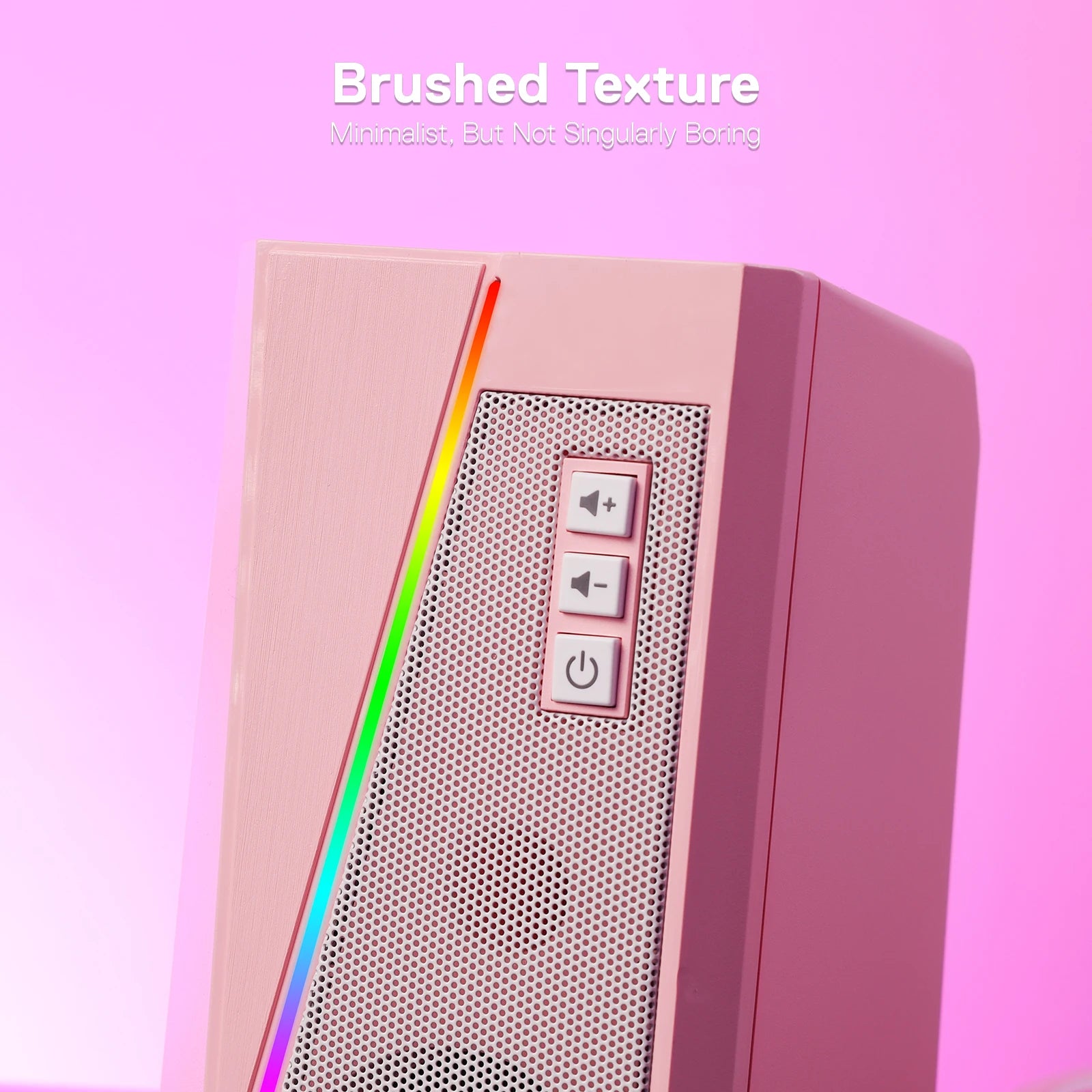 A close-up of the pink Redragon GS520 speaker, highlighting its minimalist brushed texture and front control buttons.