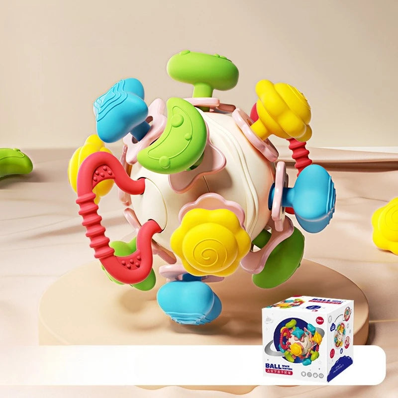 The colorful silicone baby rattle toy displayed next to its product packaging, making it an ideal gift.