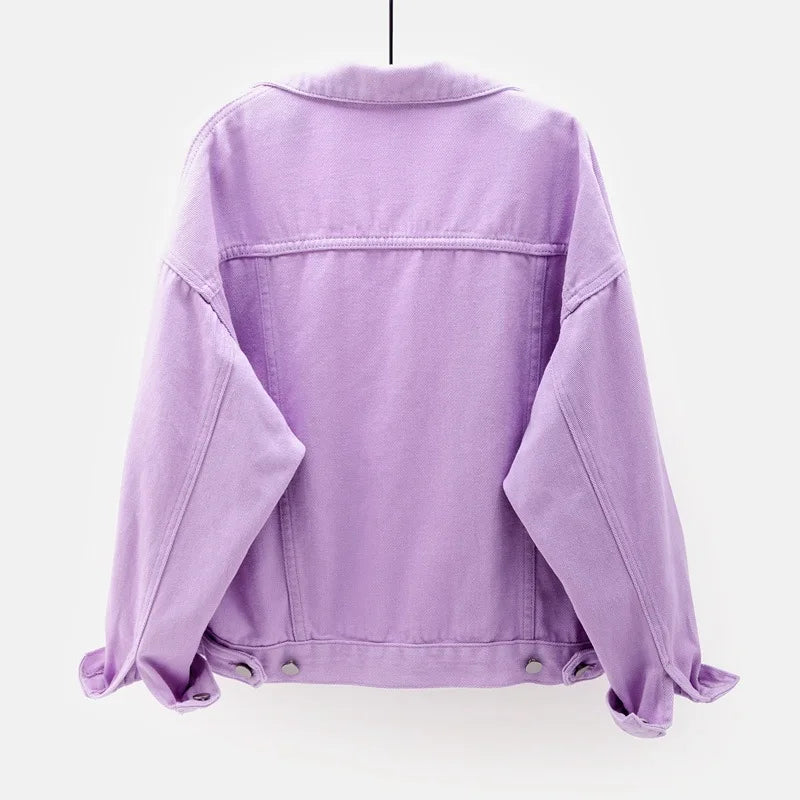 The back view of the women's oversized classic denim jacket in a pastel purple color.
