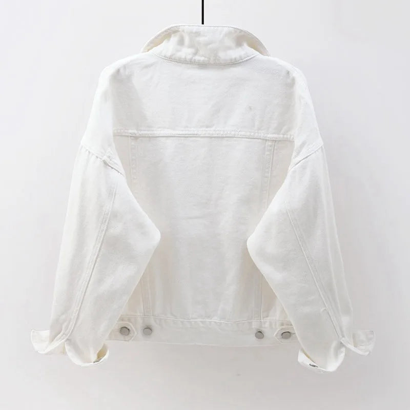 The back view of the women's oversized classic denim jacket in a crisp white color.