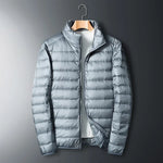 The ArcticWave men's lightweight down jacket shown in a light grey color.