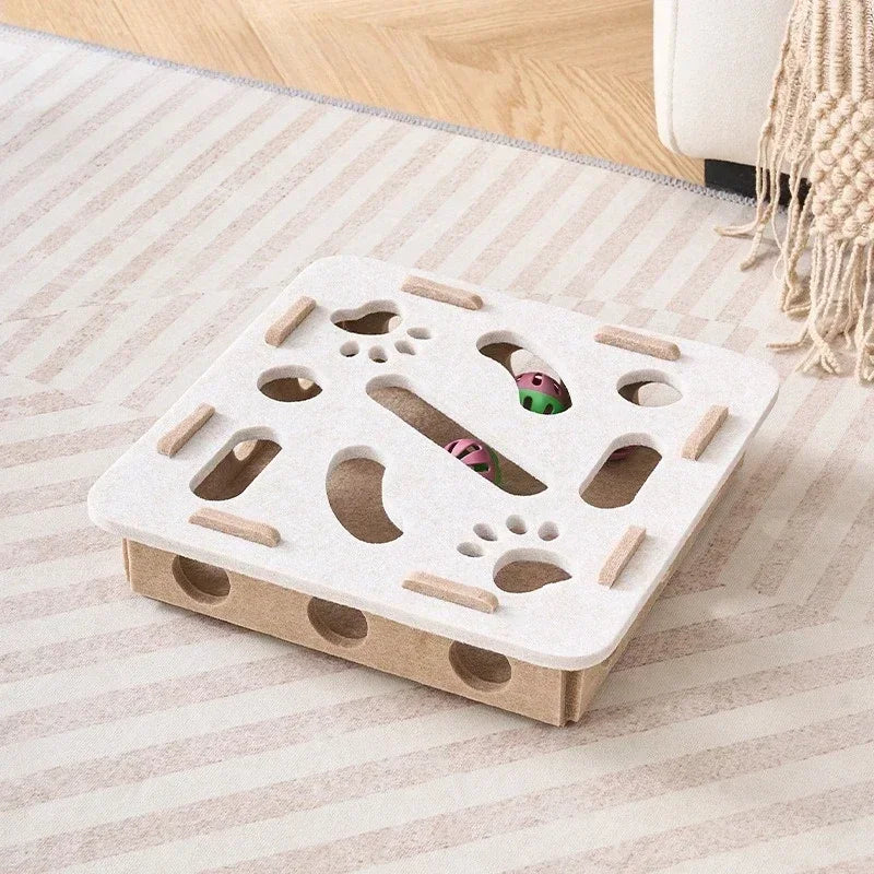 The square-shaped interactive cat puzzle box in a beige and brown felt material.
