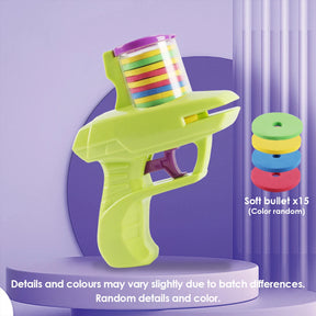 The green FunBox disc launcher toy displayed on a purple pedestal, showing it comes with 15 colorful soft bullets.