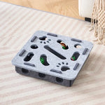The square-shaped interactive cat puzzle box in a light and dark grey felt material.