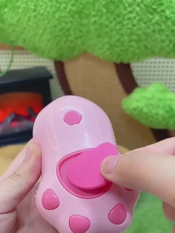 A video demonstrating the use of the paw-shaped pet steamy brush, showing how to add water or serum, groom a cat, and easily remove the collected fur.