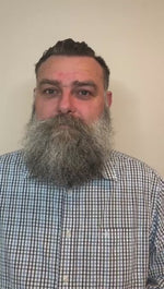 A demonstration video showing a man with a large, scruffy beard using the heated straightening brush to easily comb and style his beard, resulting in a much neater and well-groomed appearance.