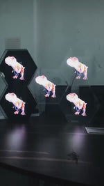 A video showing multiple 3D hologram fans working together to display various colorful and dynamic animations, including dinosaurs, emojis, and Pokémon characters.