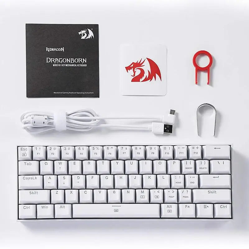 All items included with the Redragon K630 Dragonborn keyboard: the keyboard itself, instruction manual, sticker, detachable USB-C cable, and keycap puller.