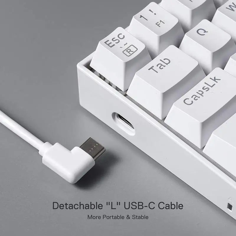 A close-up of the Redragon K630 keyboard showing the detachable "L" shaped USB-C cable for portability.