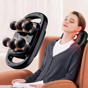 A woman relaxing in a chair with her eyes closed while using the 6-head electric massager on her neck for stress relief.