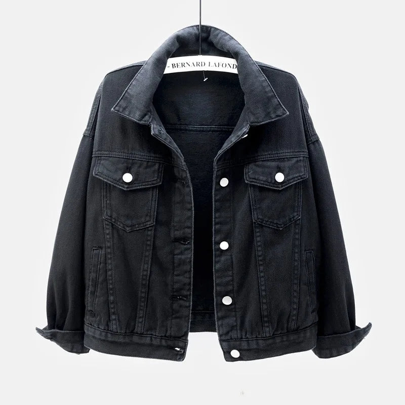 The women's oversized classic denim jacket in a classic black color, shown from the front.