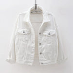The women's oversized classic denim jacket in a crisp white color, shown from the front.