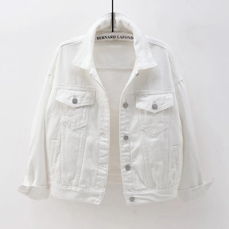 The women's oversized classic denim jacket in a crisp white color, shown from the front.